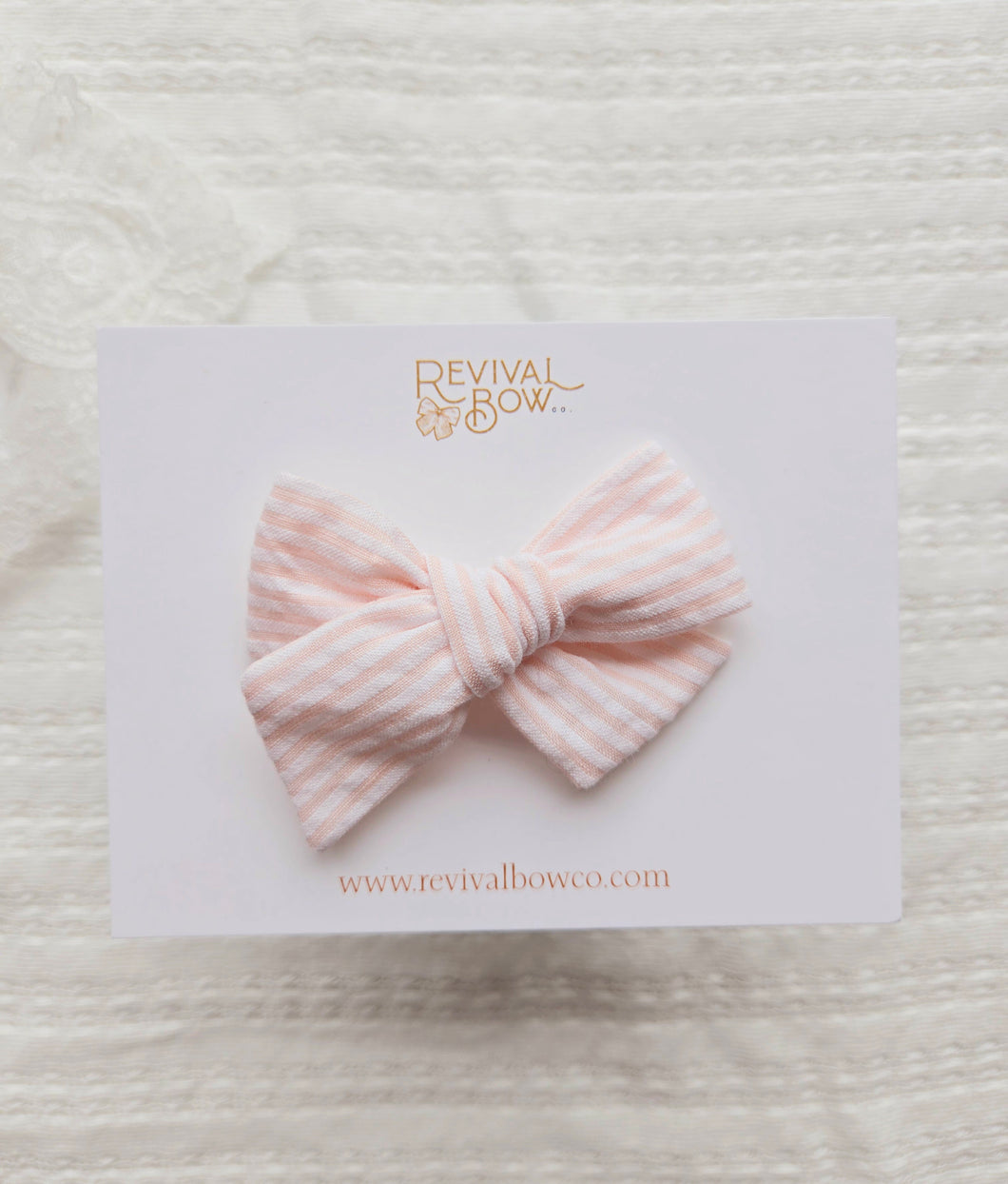 Small Pinwheel Bow • Peachy Pink Stripe